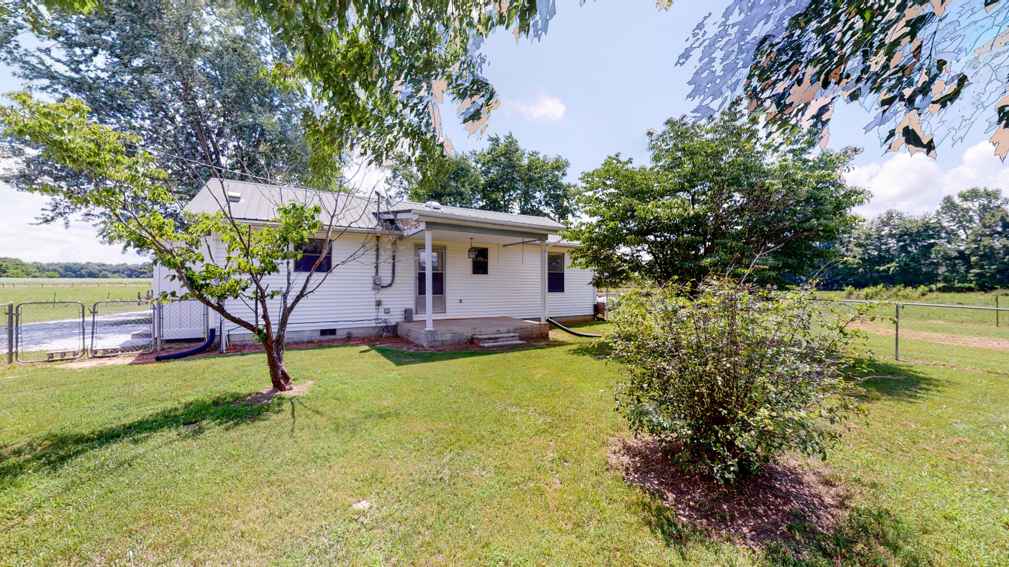 83 Hotel Road Flintville, TN 37335 - Photo 24 of 39 a view of a house with backyard and sitting area