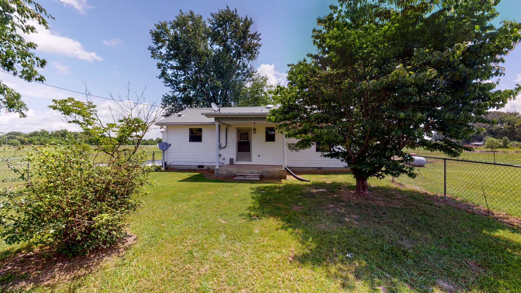 83 Hotel Road Flintville, TN 37335 - Photo 25 of 39 a front view of a house with garden
