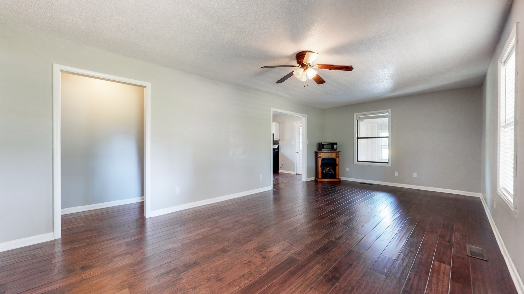 83 Hotel Road Flintville, TN 37335 - Photo 4 of 39 a view of a room with wooden floor and ceiling fan