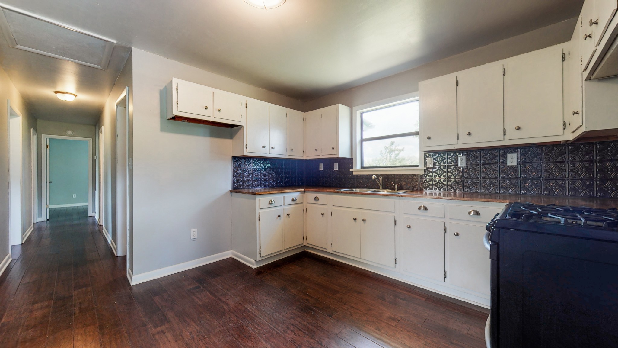 83 Hotel Road Flintville, TN 37335 - Photo 7 of 39 a kitchen with granite countertop white cabinets and white appliances