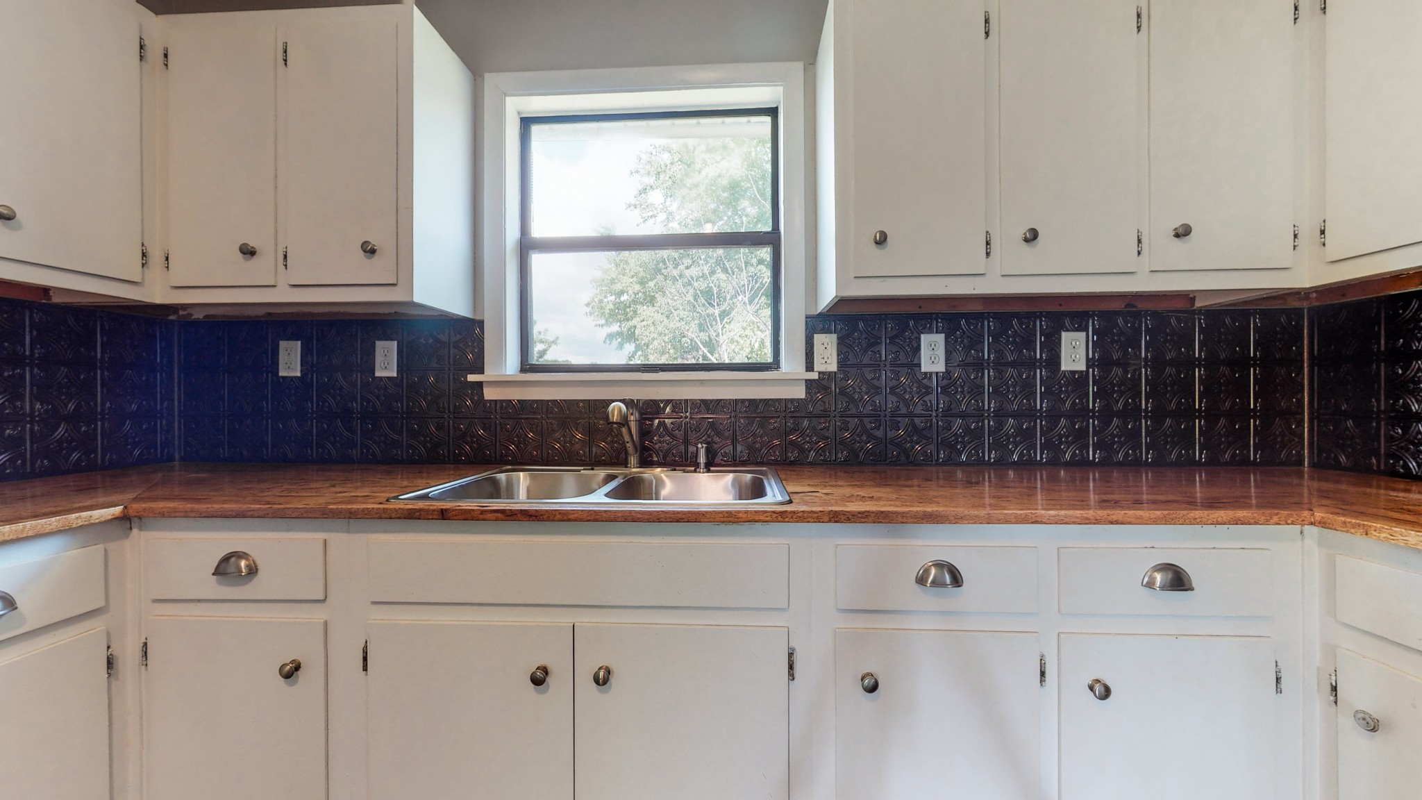 83 Hotel Road Flintville, TN 37335 - Photo 10 of 39 a kitchen with granite countertop white cabinets and sink