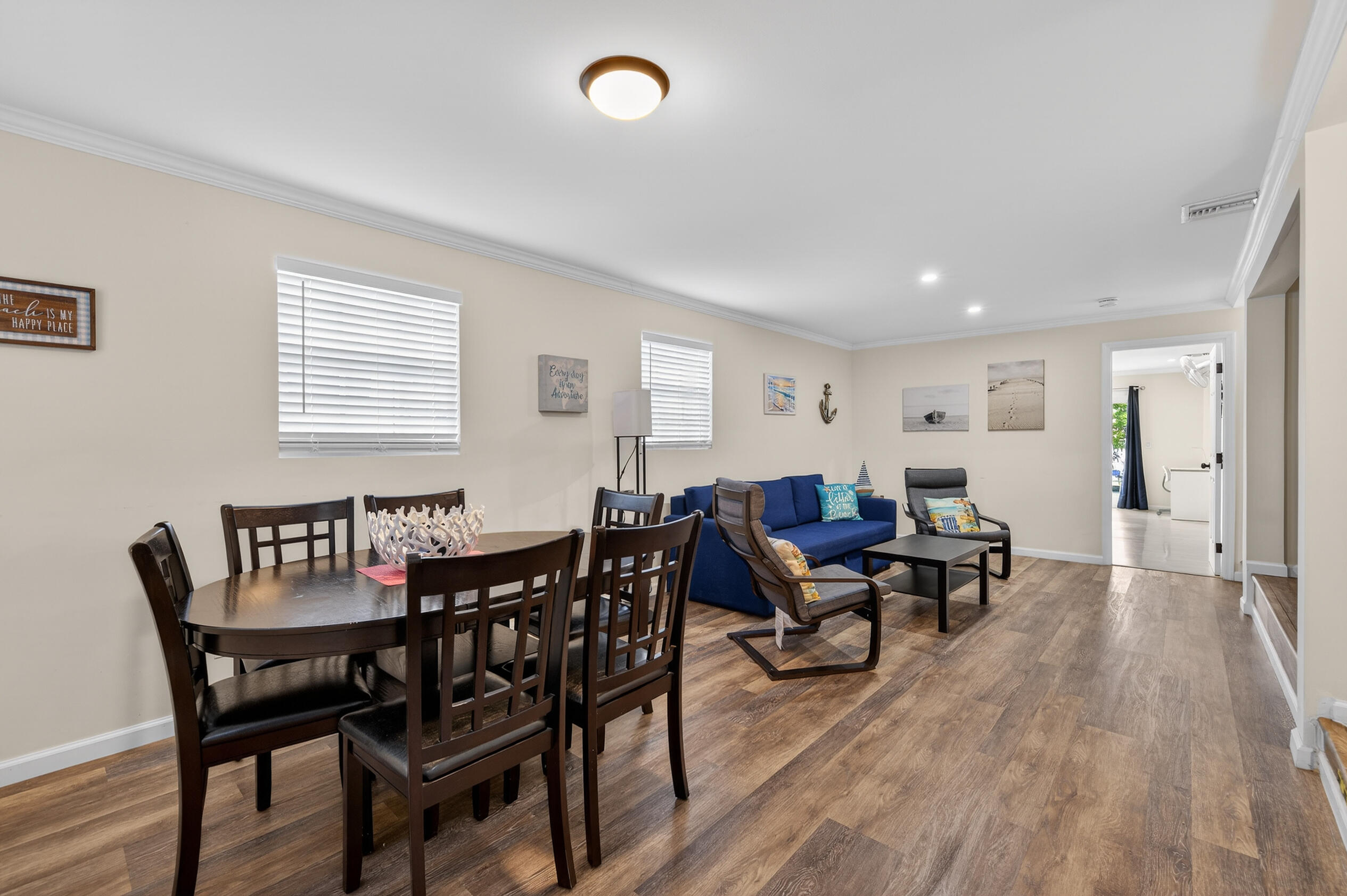 27 Riviera Drive Key West, FL 33040 - Photo 2 of 23 a view of a dining room with furniture and wooden floor