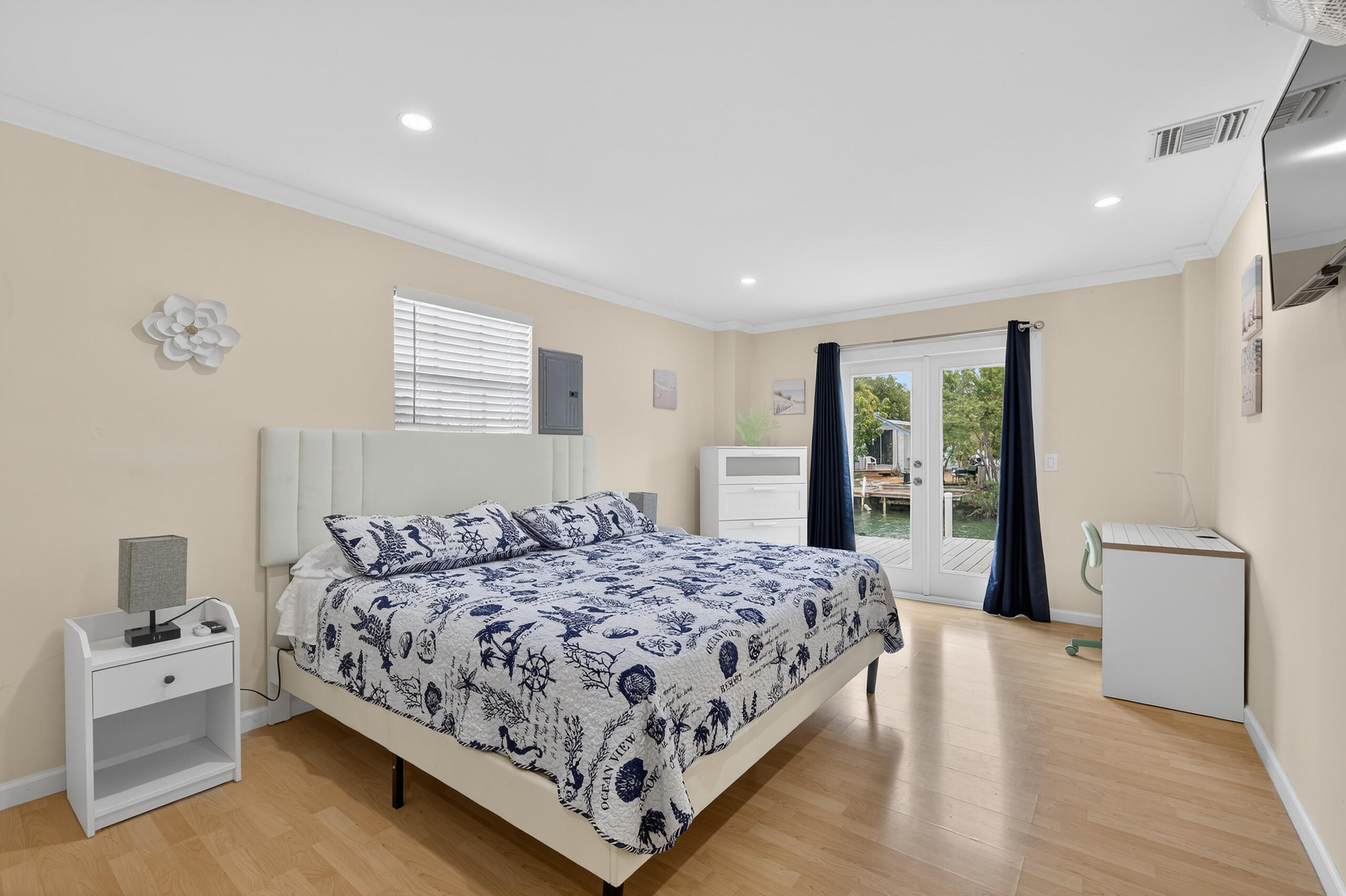 27 Riviera Drive Key West, FL 33040 - Photo 5 of 23 a bedroom with a large bed and a large window