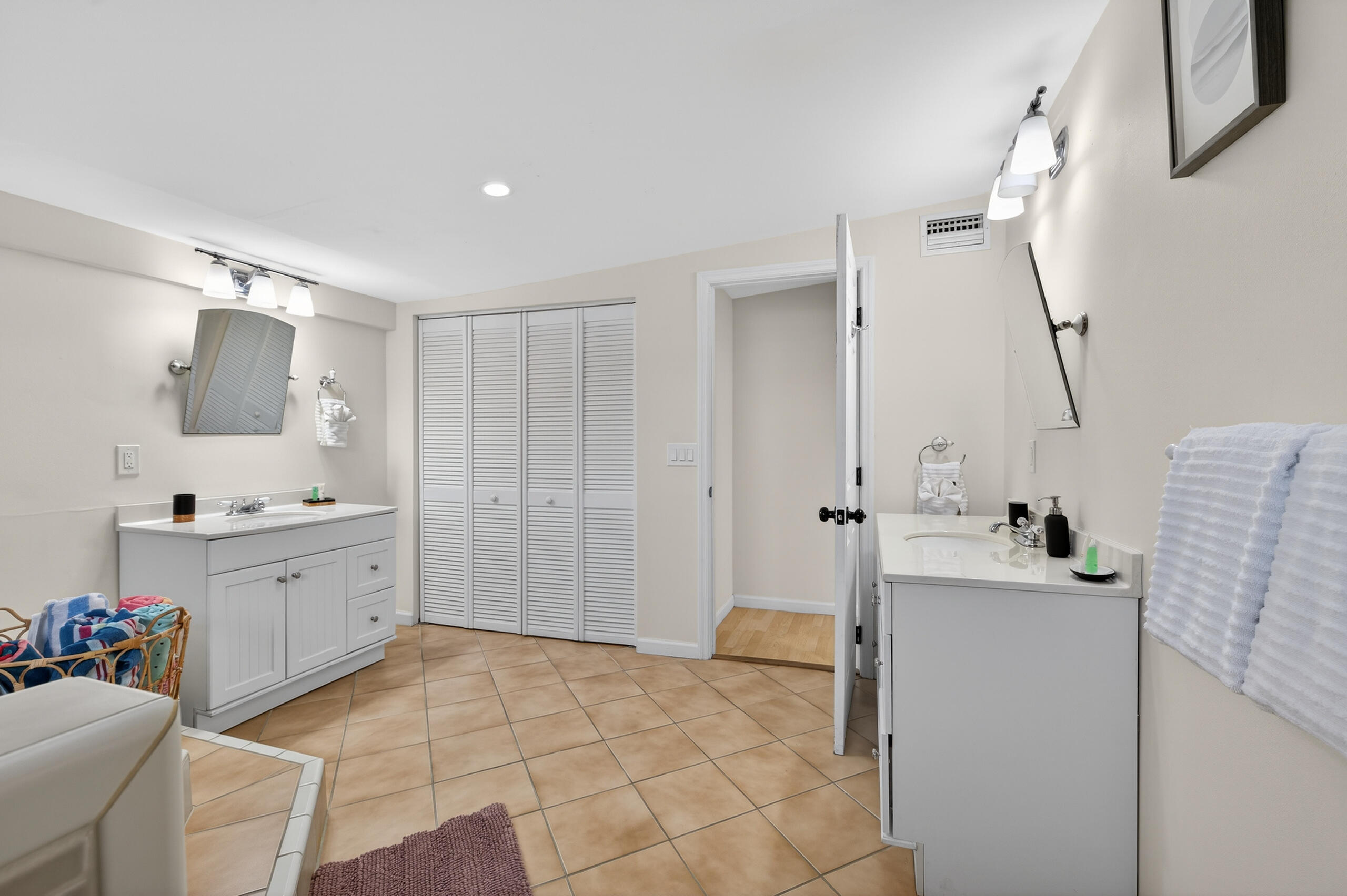 27 Riviera Drive Key West, FL 33040 - Photo 8 of 23 a bathroom with a sink mirror and a bathtub