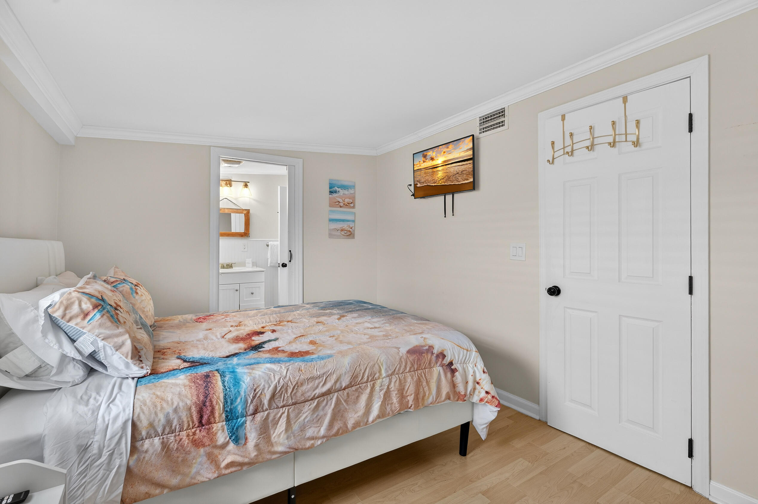 27 Riviera Drive Key West, FL 33040 - Photo 10 of 23 a bedroom with a bed and painting on the wall