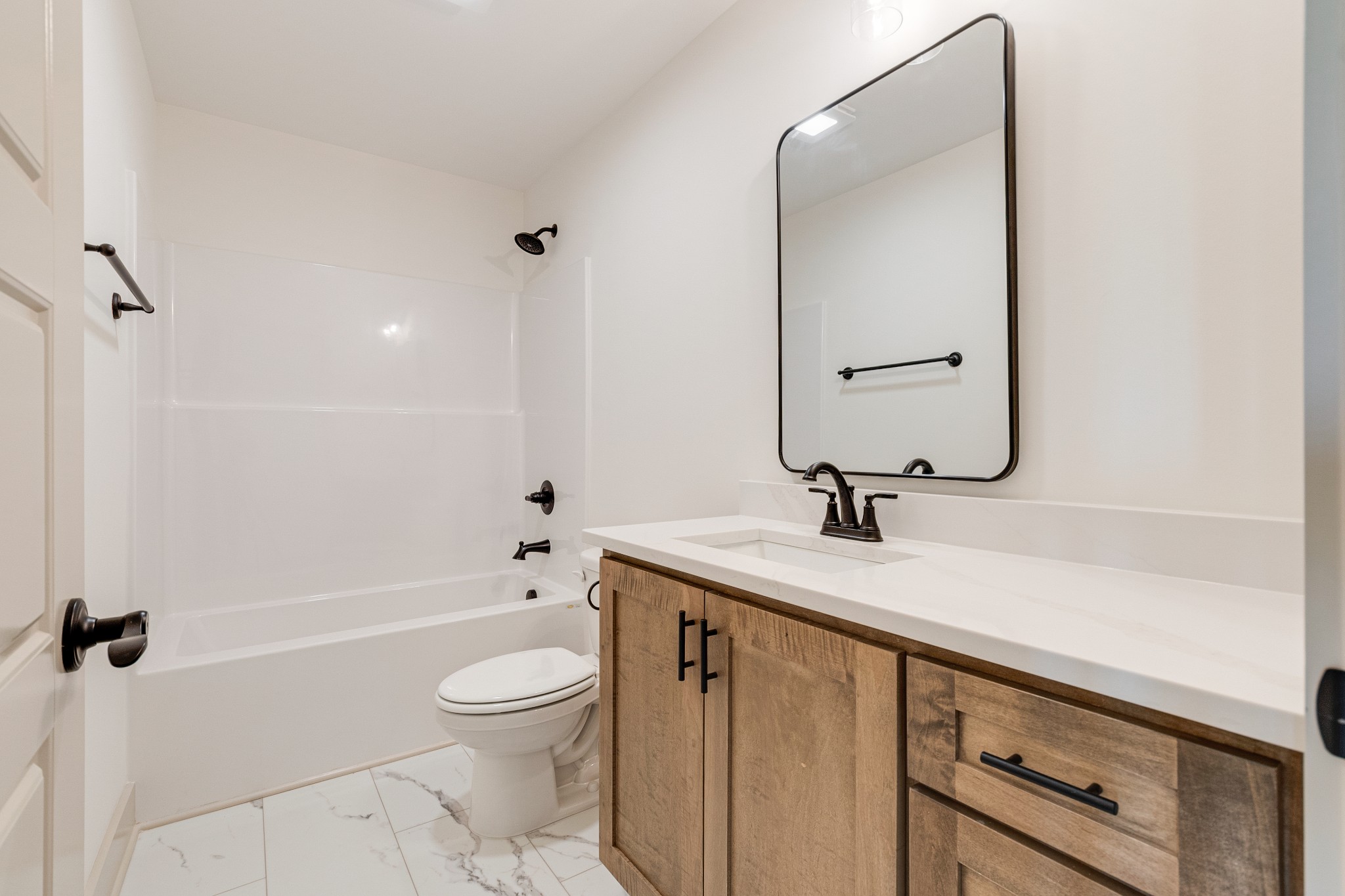 922 Butler Bridge Road Portland, TN 37148 - Photo 24 of 30 a bathroom with a granite countertop sink a toilet and a mirror