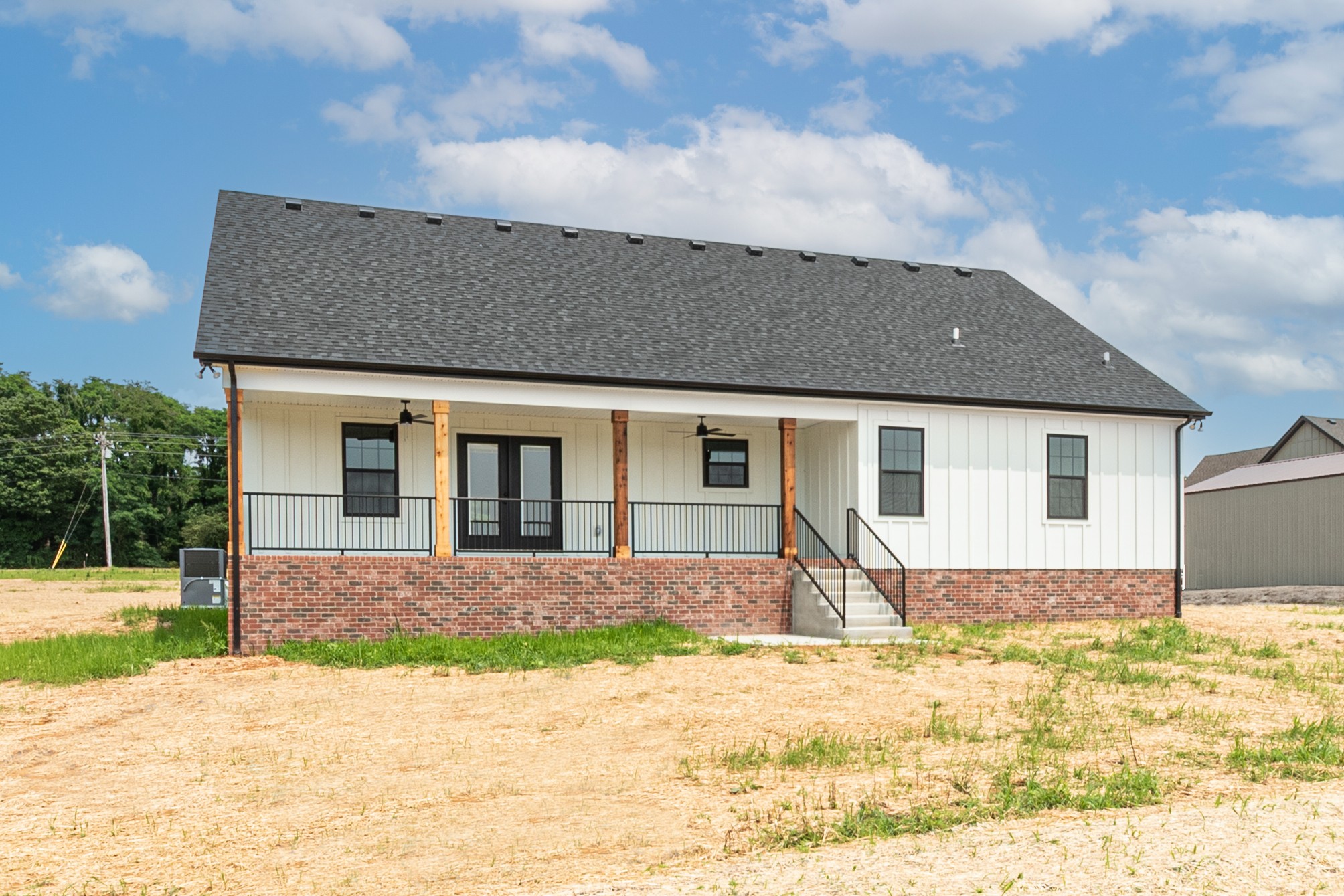 922 Butler Bridge Road Portland, TN 37148 - Photo 30 of 30 a front view of a house with a yard and garage