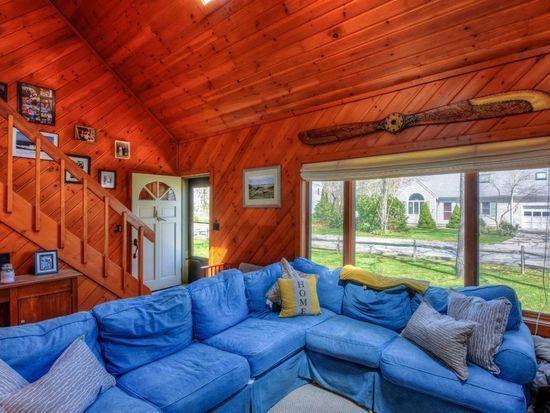 60 Neshobe Road Mashpee, MA 02649 - Photo 3 of 12 a living room with furniture and a large window
