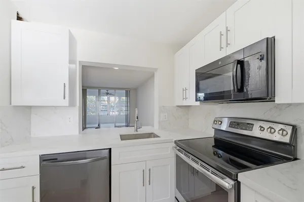 a kitchen with a stove and a microwave