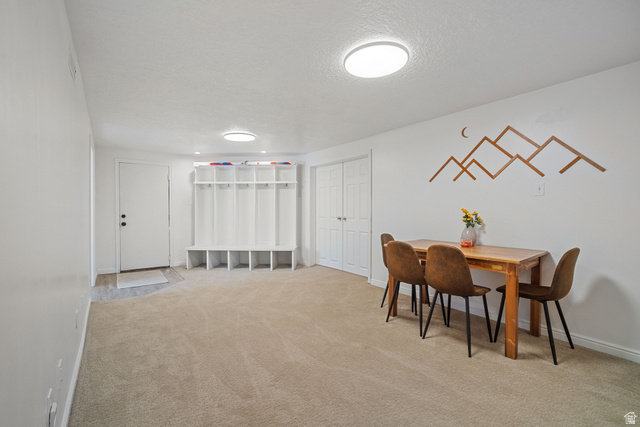 4426 South 3035 East Holladay, UT 84124 - Photo 30 of 49 Dining room featuring a textured ceiling and carpet floors