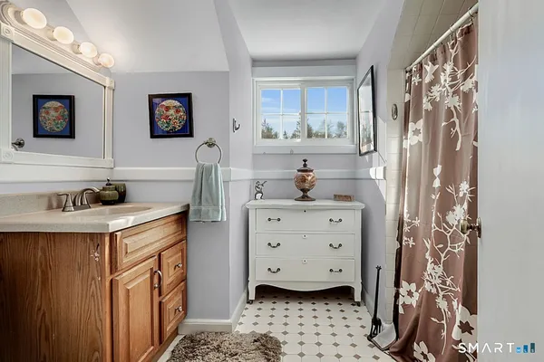 a kitchen with a refrigerator sink and cabinets