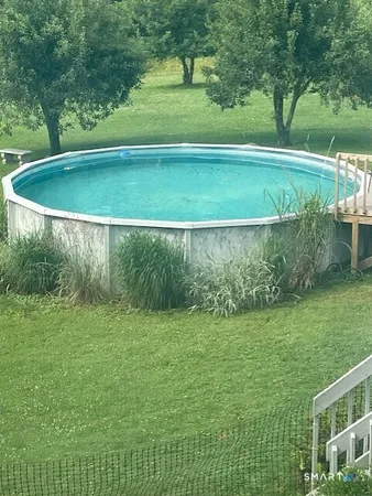 a view of a golf ground with a small yard