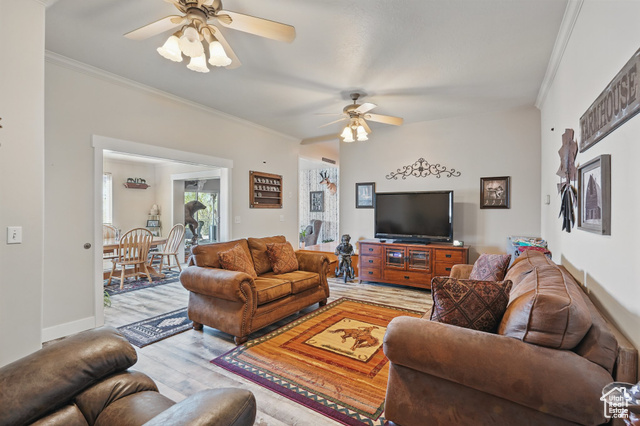 2490 South State Street Springville, UT 84663 - Photo 22 of 38 Living area featuring light wood-style floors, a ceiling fan, and ornamental molding