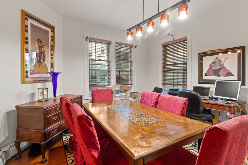 1 Copeland Place Boston, MA 02119 - Photo 11 of 31 a view of a dining room with furniture and window