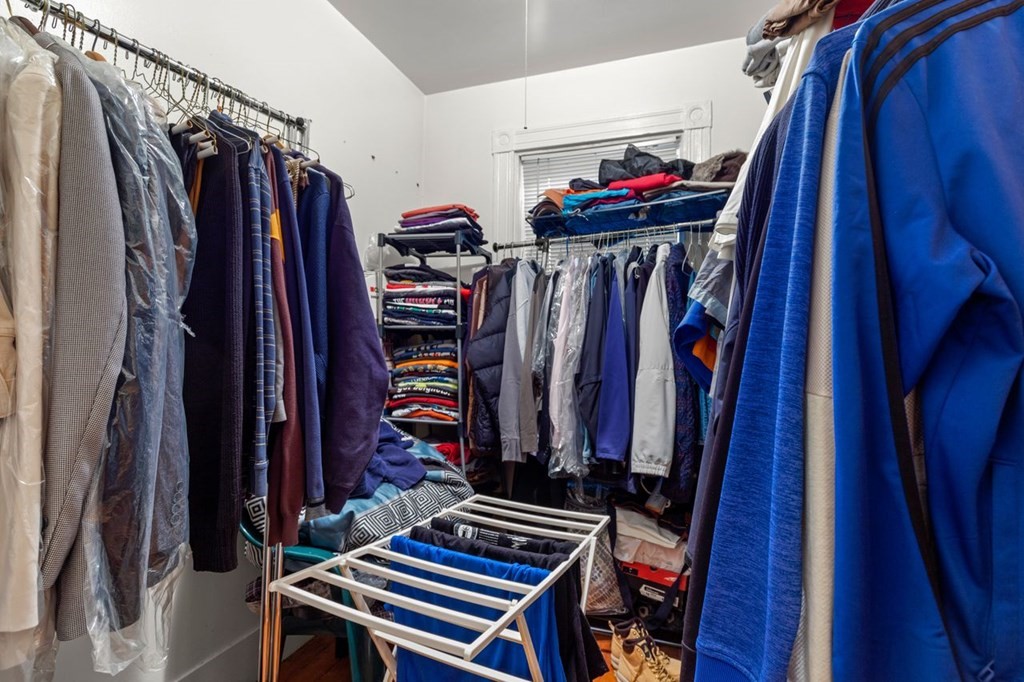 1 Copeland Place Boston, MA 02119 - Photo 16 of 31 a view of walk in closet with clothes and shoes