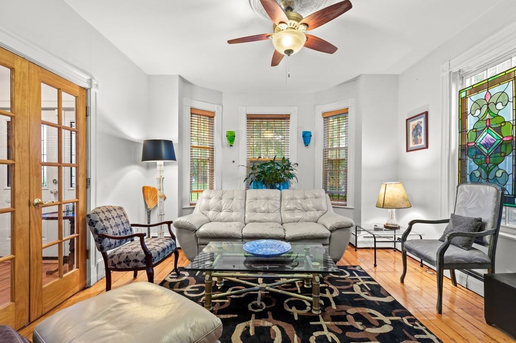 1 Copeland Place Boston, MA 02119 - Photo 5 of 31 a living room with furniture and a large window