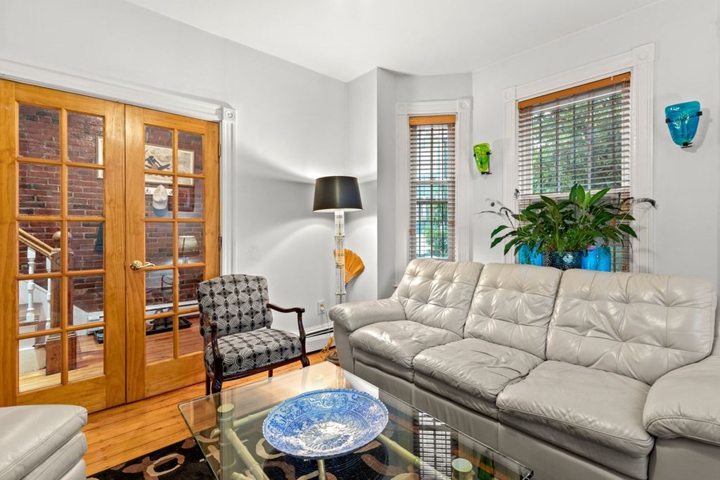 1 Copeland Place Boston, MA 02119 - Photo 6 of 31 a living room with furniture and a window