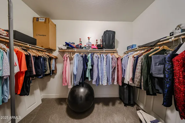 a kitchen with granite countertop a sink a counter top space and stainless steel appliances