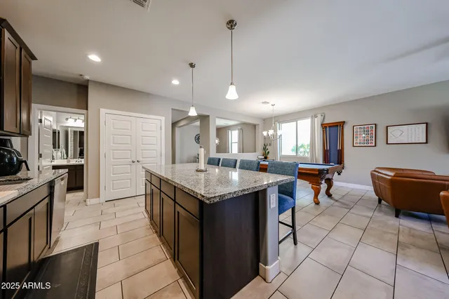 a kitchen with stainless steel appliances granite countertop a stove and a sink