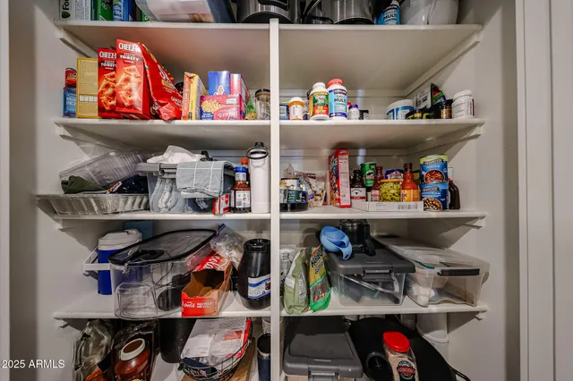 a view of a patio with couches table and chairs with garden and plants