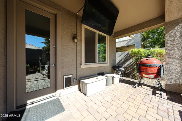 a view of a house with backyard outdoor seating area and furniture