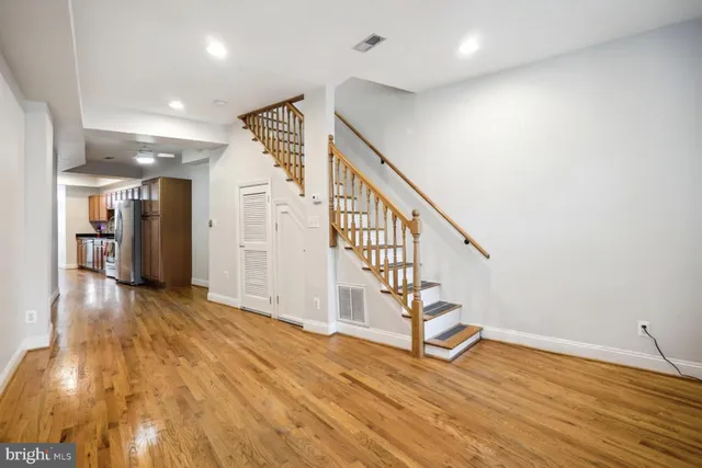 a view of entryway with wooden floor