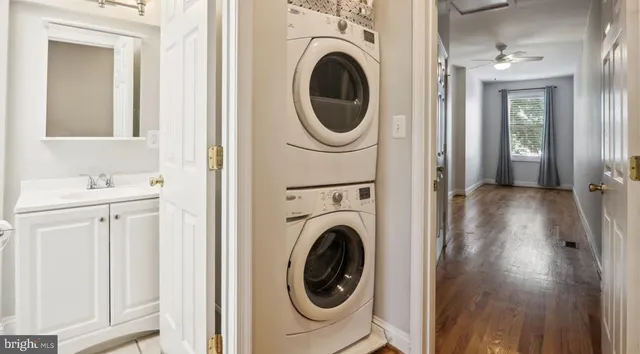 a view of a hallway with washer and dryer