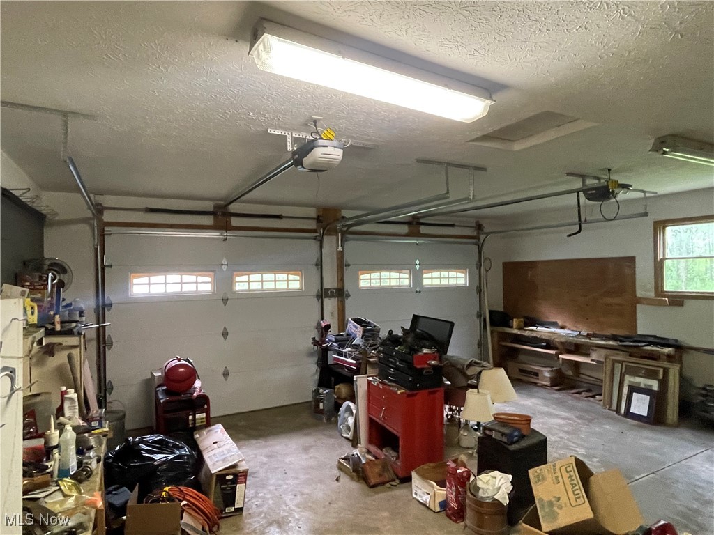 9439 Williams Road Diamond, OH 44412 - Photo 14 of 18 Garage featuring a garage door opener
