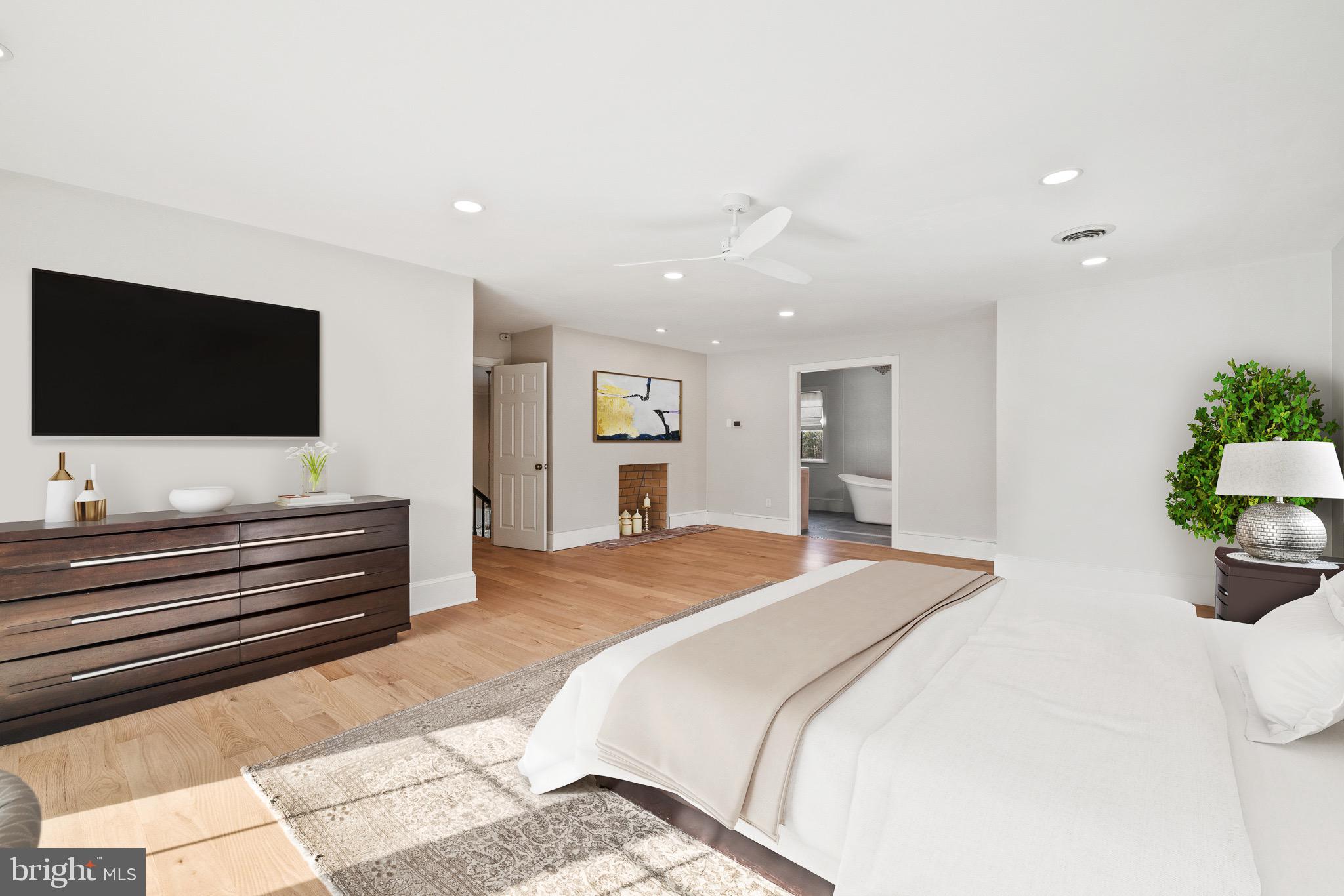 1400 Fairhill Road Sellersville, PA 18960 - Photo 21 of 41 a spacious bedroom with a bed and a flat screen tv