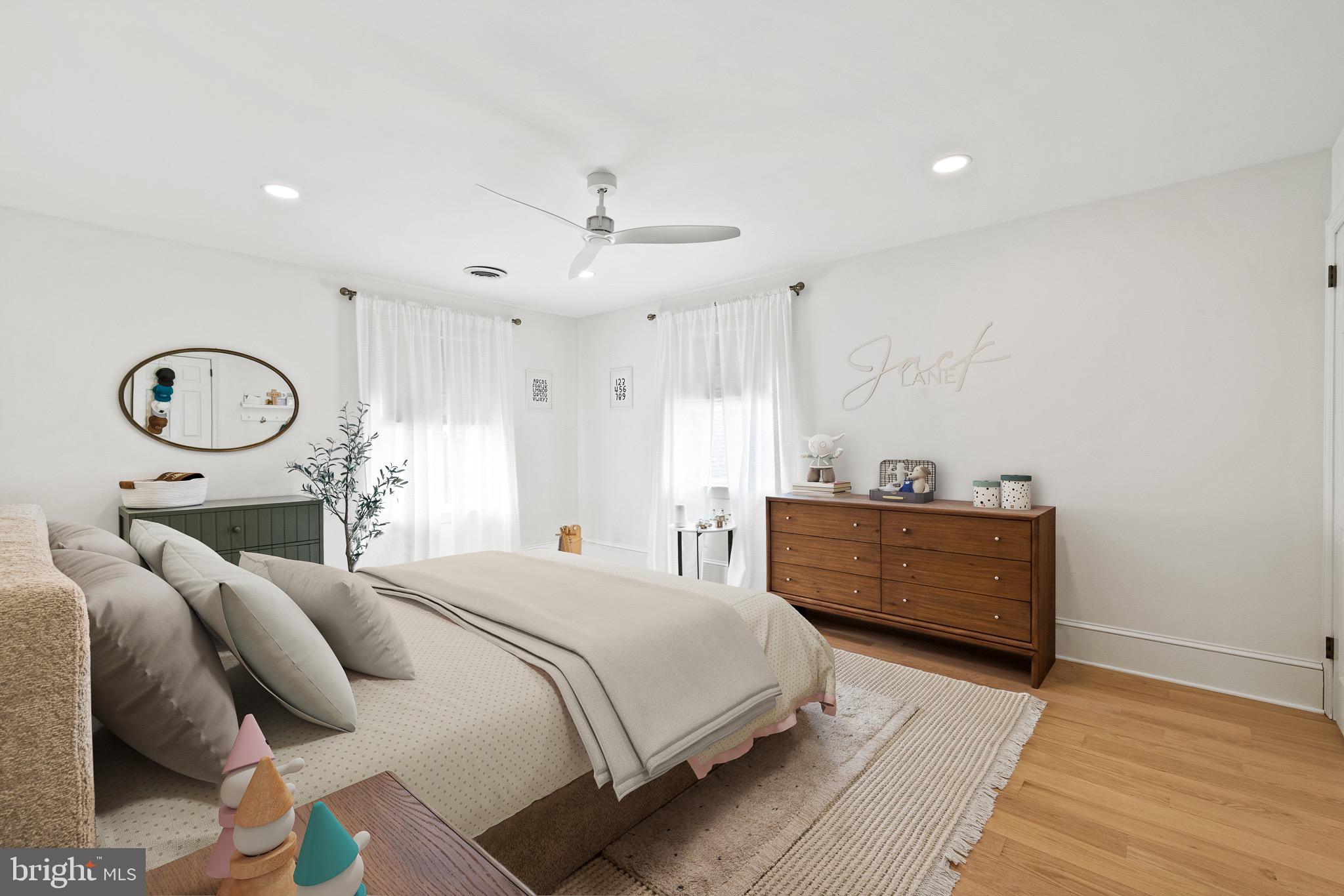 1400 Fairhill Road Sellersville, PA 18960 - Photo 31 of 41 a bedroom with a bed and a chandelier