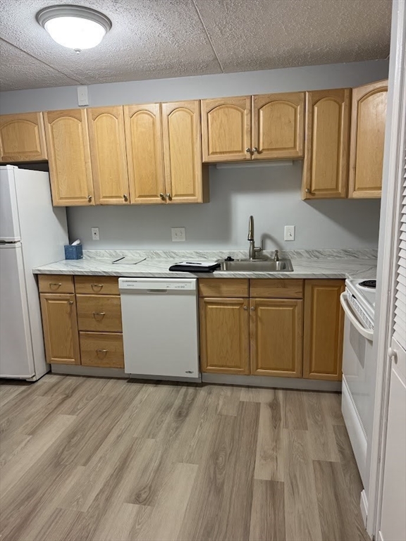 575 Broad Street, Unit 101 Weymouth, MA 02189 - Photo 2 of 9 a kitchen with a sink stove and cabinets
