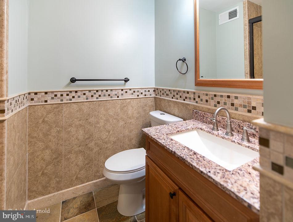 7922 Pebble Brook Court Springfield, VA 22153 - Photo 20 of 26 Slate tile floors in upper hall bath
