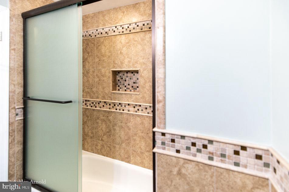 7922 Pebble Brook Court Springfield, VA 22153 - Photo 23 of 26 Privacy glass doors to upper hall bath
