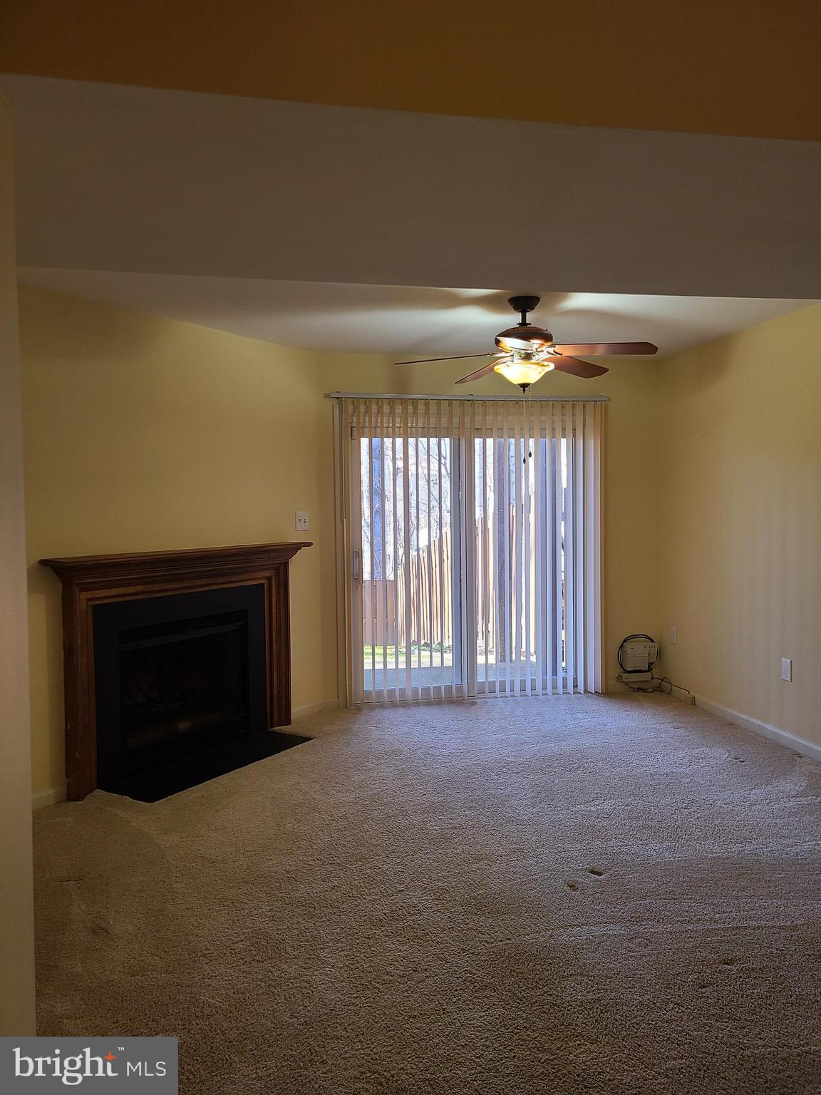 7922 Pebble Brook Court Springfield, VA 22153 - Photo 24 of 26 Cozy basement with fireplace and sliders to patio