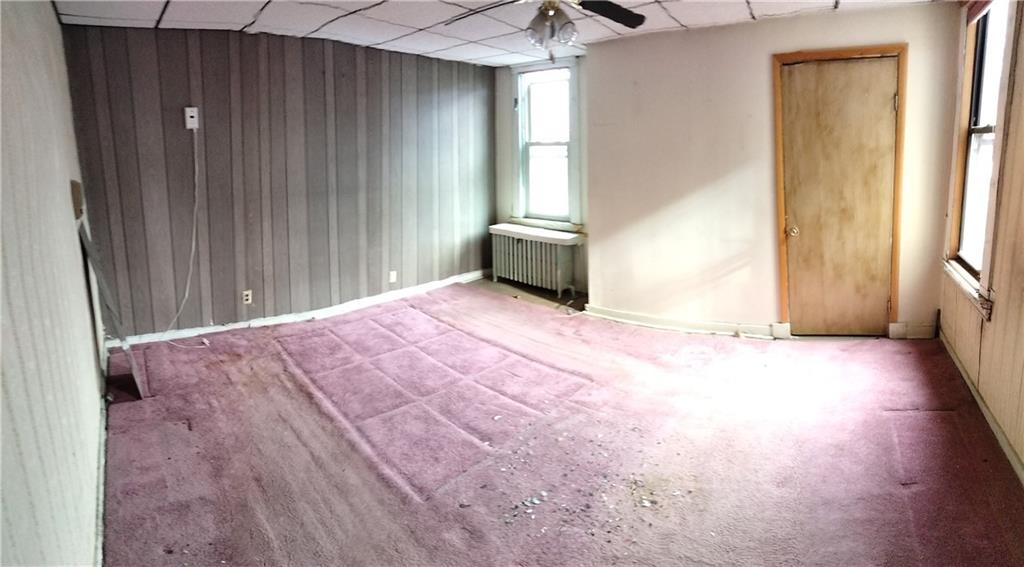 522 Freeland Street Pittsburgh, PA 15210 - Photo 11 of 19 a view of a livingroom with wooden floor and a window