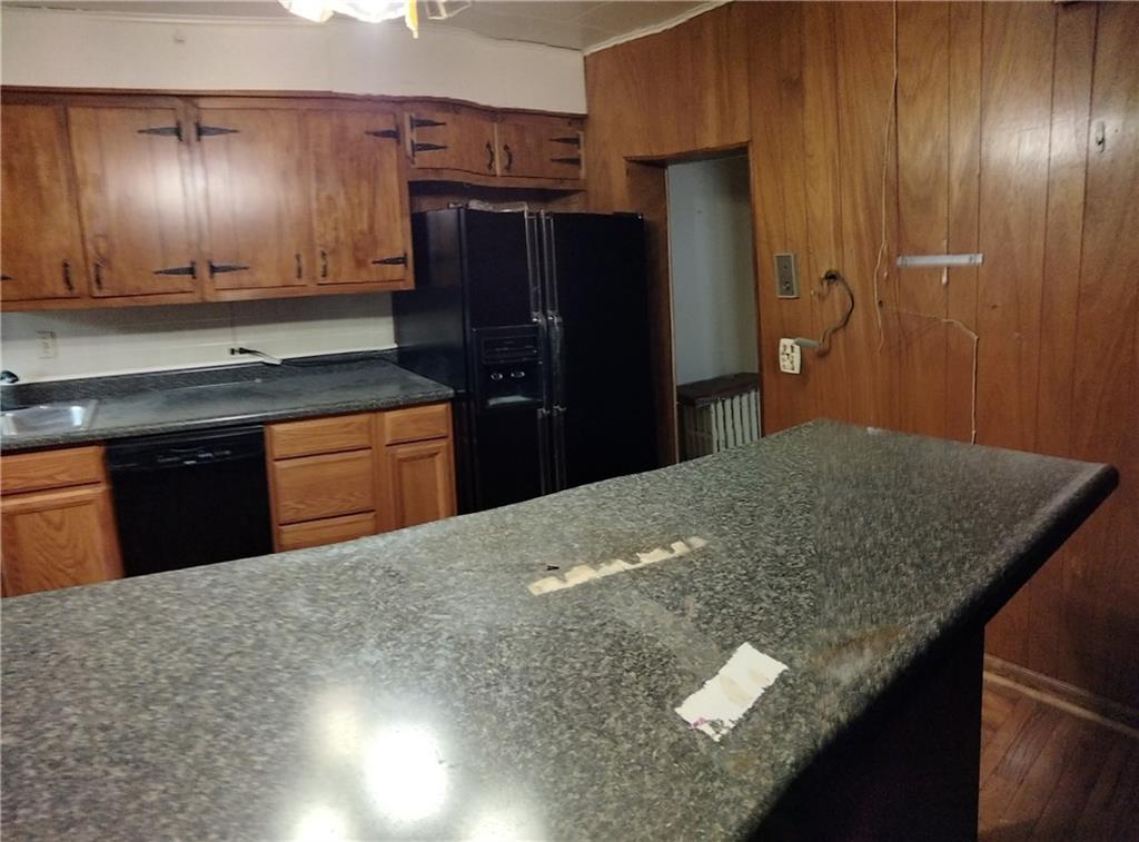 522 Freeland Street Pittsburgh, PA 15210 - Photo 4 of 19 a kitchen with stainless steel appliances granite countertop cabinets and refrigerator