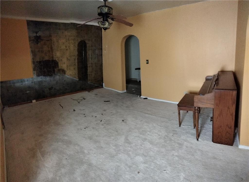 522 Freeland Street Pittsburgh, PA 15210 - Photo 8 of 19 a view of a livingroom with furniture and a ceiling fan