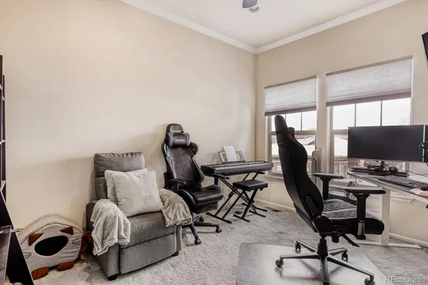 a view of workspace with wooden floor windows