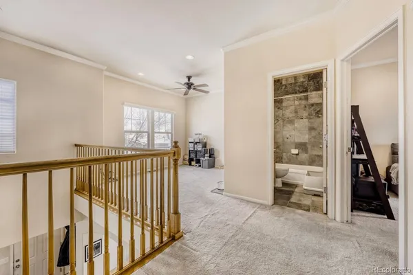 a view of a livingroom with furniture and staircase