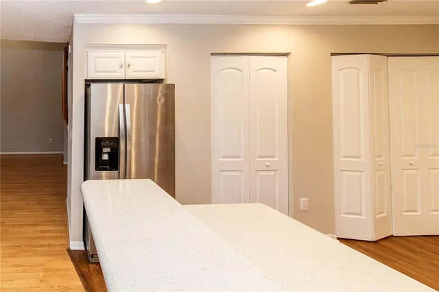 a large white bed in a white room