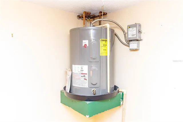 a view of a living room with a table and a chandelier