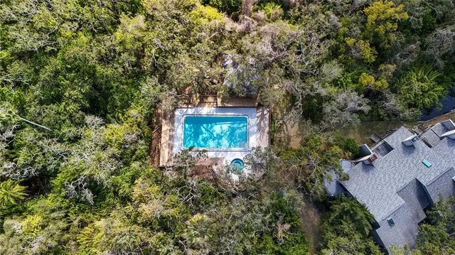 an aerial view of house with yard