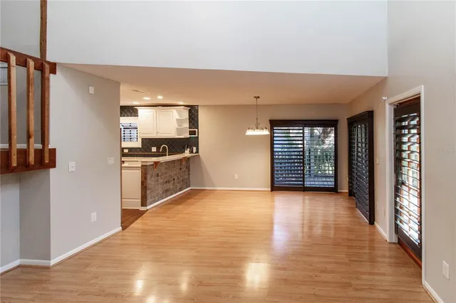 a view of a kitchen with a sink and a window