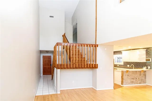 a view of a bedroom with wooden floor