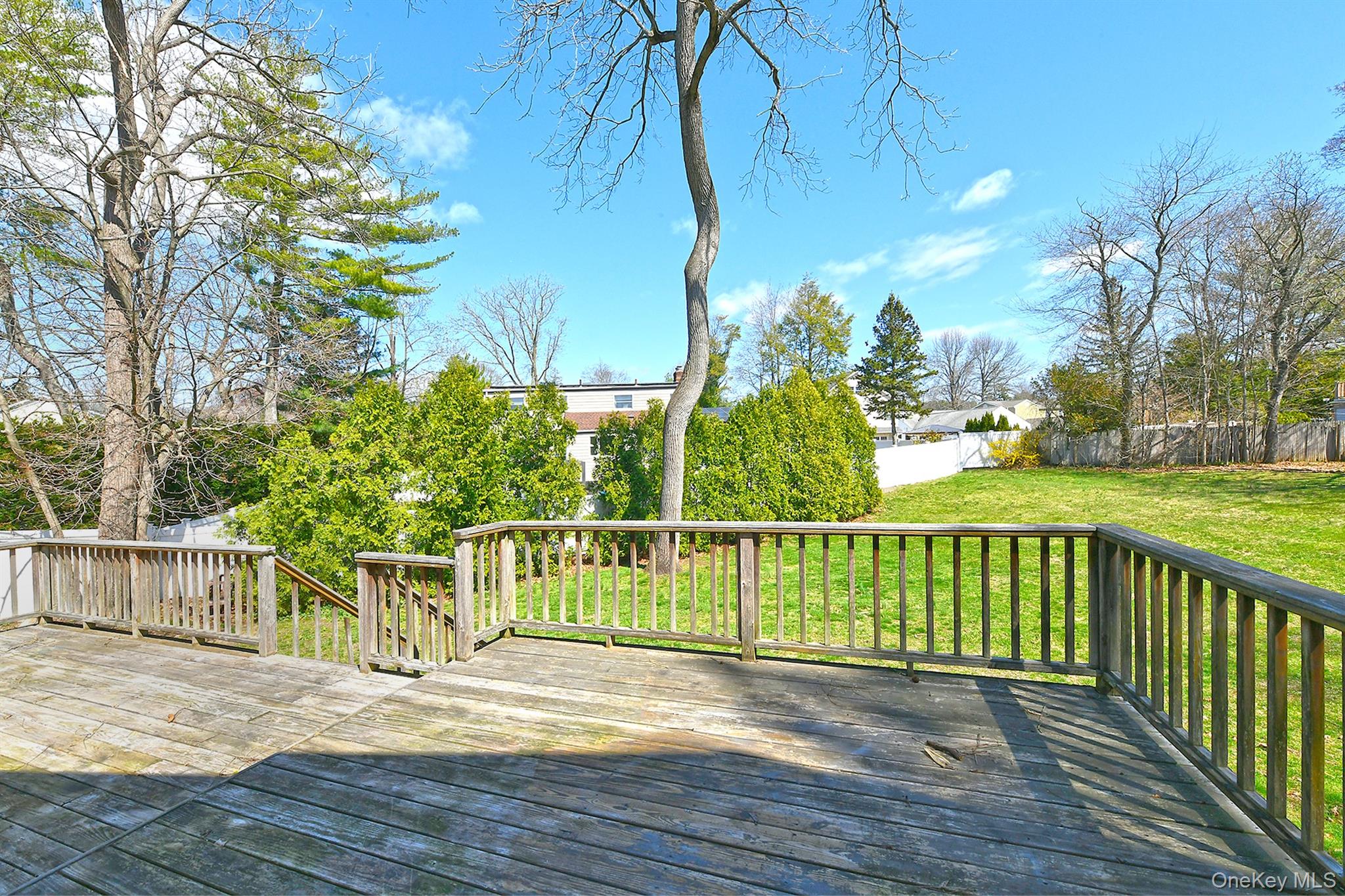 86 Horton Place Syosset, NY 11791 - Photo 18 of 22 a view of a wooden deck and city view