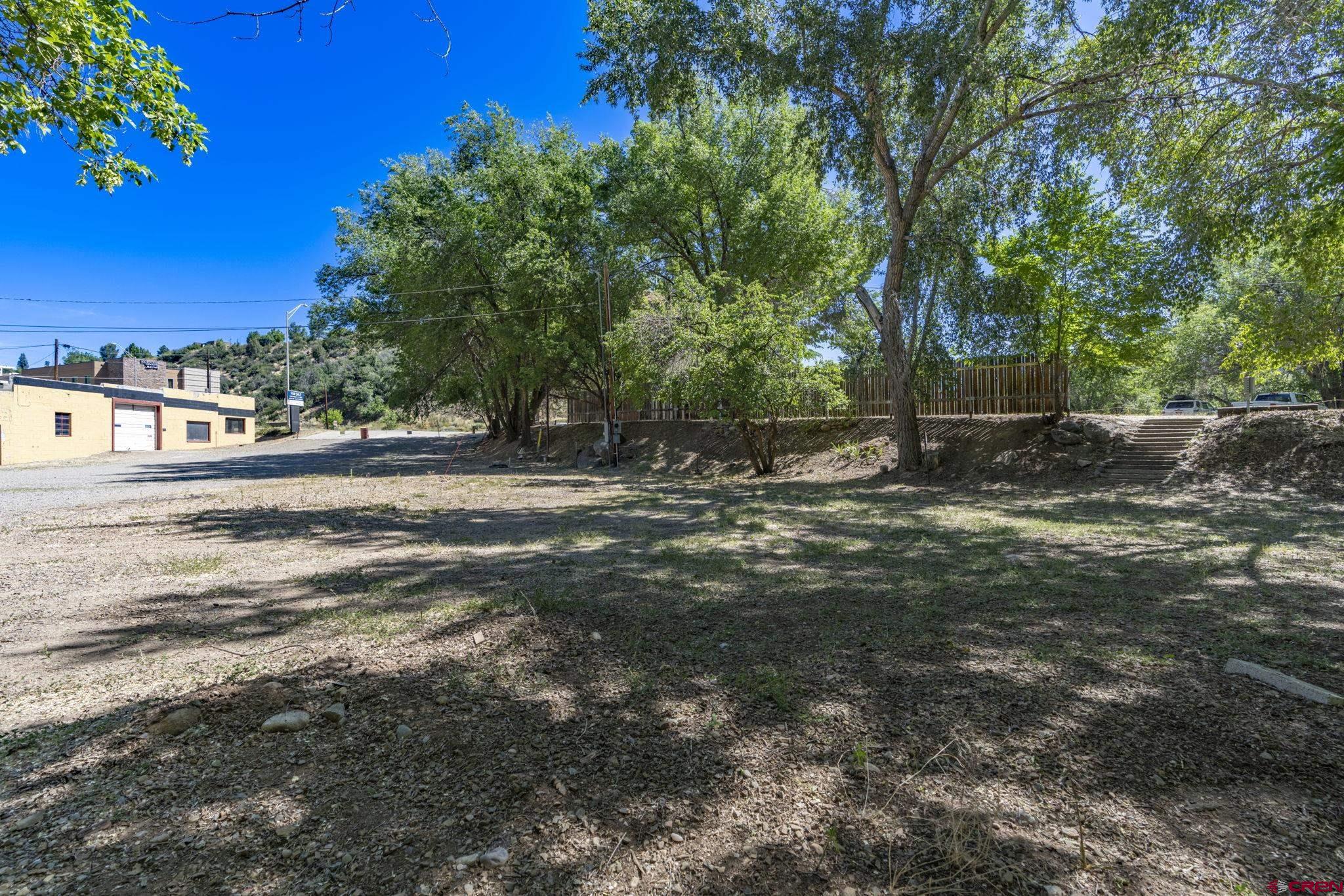 4 West Us Highway Durango, CO 81303 - Photo 20 of 23 a backyard of a house with lots of green space