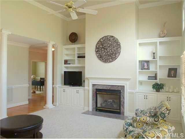 604 Mason Road Durham, NC 27712 - Photo 9 of 25 2 story familyroom with built-ins, crown molding, and decorative columns to add so much class to this quality buil home. Den/Family/Great Room