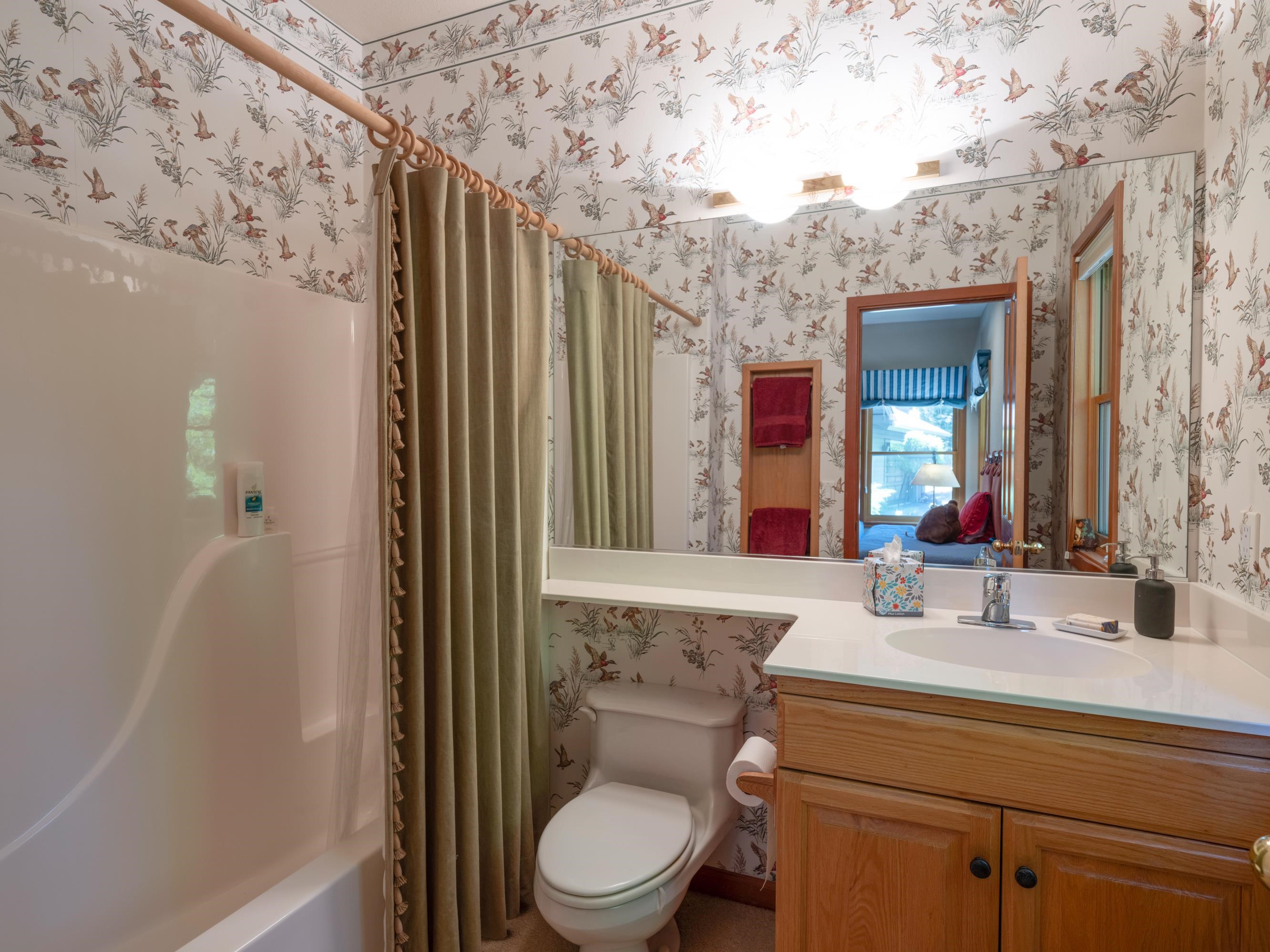 134 Quail View Circle Clio, CA 96106 - Photo 23 of 49 a bathroom with a toilet a sink and a large mirror