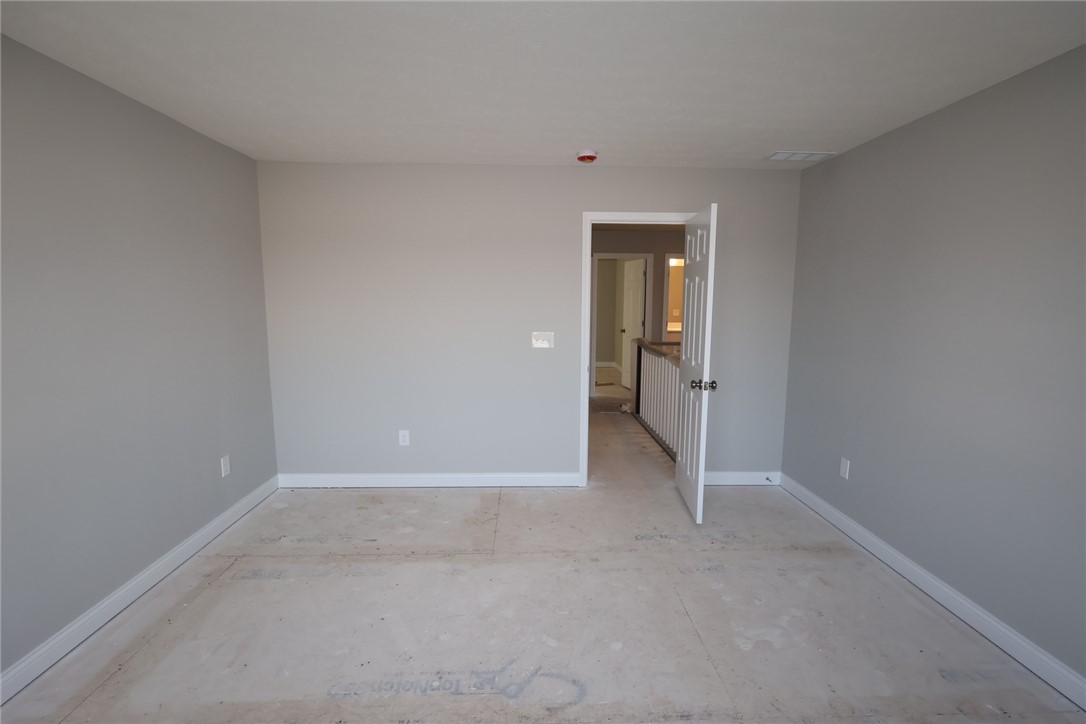 230 Tilly Court, Unit 4 Springboro, OH 45066 - Photo 12 of 20 This spacious room awaits your personal touch, offering an open canvas for creative living.