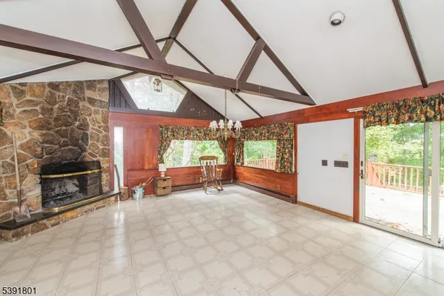 a view of a room with furniture and a window